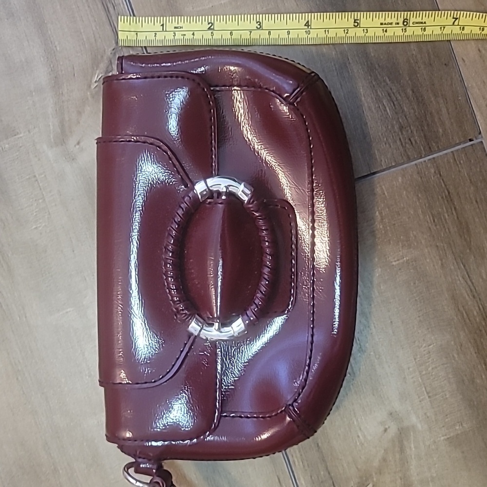Ann Taylor red wine burgundy wristlet silver metal buckle magnetic closure